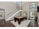 Spacious game room featuring a pool table, high ceilings, and abundant natural light at 934 Deerwood Loop, Longwood, FL 32779
