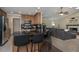 Well-appointed kitchen with granite countertops, stainless steel appliances, and breakfast bar seating at 934 Deerwood Loop, Longwood, FL 32779