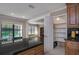 Open kitchen area with pantry; view into dining room and backyard at 934 Deerwood Loop, Longwood, FL 32779