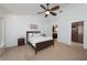 Main bedroom featuring neutral walls, ceiling fan and an ensuite bathroom at 934 Deerwood Loop, Longwood, FL 32779