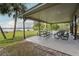 Spacious outdoor pavilion with picnic tables, perfect for gatherings with lake views and a relaxing atmosphere at 934 Deerwood Loop, Longwood, FL 32779