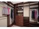 Organized walk-in closet features custom shelving, drawers, and hanging rods for ample storage at 934 Deerwood Loop, Longwood, FL 32779