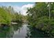 Scenic waterfront view with a launch point, ideal for kayaking and enjoying the tranquil water environment at 934 Deerwood Loop, Longwood, FL 32779