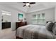 Bedroom featuring a wooden dresser, a neutral color scheme and an ensuite bathroom at 9349 Sweet Maple Ave, Orlando, FL 32832