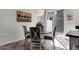 Charming dining area with a round table, four chairs, and natural light from the sliding glass door at 9349 Sweet Maple Ave, Orlando, FL 32832