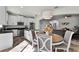 Bright kitchen and dining area featuring modern appliances and plenty of seating at 9349 Sweet Maple Ave, Orlando, FL 32832