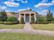 Stunning home featuring a grand entrance with columns and lush landscaping at 9349 Sweet Maple Ave, Orlando, FL 32832