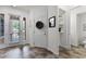 Home foyer featuring tile flooring, white walls, closet and front door with glass panels at 9349 Sweet Maple Ave, Orlando, FL 32832