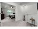 Hallway view of a bedroom with a tray ceiling and neutral decor at 9349 Sweet Maple Ave, Orlando, FL 32832