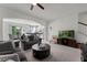 Open concept living room with archway to dining area, white cabinets and carpeted floors at 9349 Sweet Maple Ave, Orlando, FL 32832