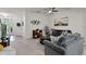 Comfortable living room with decorative accessories, carpeted floors, and access to home entryway at 9349 Sweet Maple Ave, Orlando, FL 32832