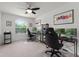 Bright office space featuring two desks and large windows, perfect for working from home at 9349 Sweet Maple Ave, Orlando, FL 32832