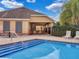 Community pool with a covered lounge area, chairs, and picnic tables, enhancing the outdoor experience at 9349 Sweet Maple Ave, Orlando, FL 32832