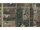 Aerial view of a spacious lot in a quiet, residential neighborhood surrounded by lush trees and established homes at 0 Sabal St, Orlando, FL 32833