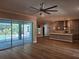 Spacious living room with hardwood floors and sliding glass doors that lead to the outdoor pool area at 0 Sabal St, Orlando, FL 32833