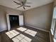 Cozy office with hardwood floors, crown moulding, and a ceiling fan at 0 Sabal St, Orlando, FL 32833