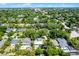 An expansive aerial showcases homes nestled amongst the lush trees and greenbelts of the manicured neighborhood at 1106 Ayrshire St, Orlando, FL 32803