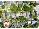 A detailed aerial shot showing the property's landscape, roof, and proximity to neighboring homes at 1106 Ayrshire St, Orlando, FL 32803