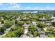 Bird's-eye view displays the property's setting amongst mature trees and the layout of the surrounding neighborhood at 1106 Ayrshire St, Orlando, FL 32803