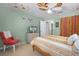 Bedroom features a comfortable bed, stylish curtains, and neutral-toned carpet at 1106 Ayrshire St, Orlando, FL 32803