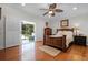 Bright bedroom with wood floors, ceiling fan, and sliding glass doors to a patio at 1106 Ayrshire St, Orlando, FL 32803