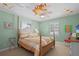 Charming bedroom featuring a unique sunburst ceiling fan and stylish furnishings at 1106 Ayrshire St, Orlando, FL 32803