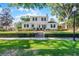 Beautiful white two-story home with black shutters and a manicured lawn at 1106 Ayrshire St, Orlando, FL 32803