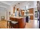 Kitchen with wooden cabinets, granite countertops, and a central island at 1106 Ayrshire St, Orlando, FL 32803