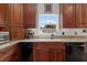 Kitchen features granite counters, window over sink, and stainless appliances at 1106 Ayrshire St, Orlando, FL 32803