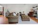 Bright living room with a sofa, ottoman, and stylish decor at 1106 Ayrshire St, Orlando, FL 32803