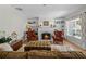 Elegant living room featuring a cozy fireplace and built-in bookshelves at 1106 Ayrshire St, Orlando, FL 32803