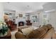 Inviting living room with a fireplace, plush seating, and natural light at 1106 Ayrshire St, Orlando, FL 32803