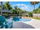 Enjoy the inviting in-ground pool with outdoor dining and lush landscaping at 1106 Ayrshire St, Orlando, FL 32803