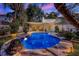 Backyard view featuring a sparkling pool and the rear of a two-story home at 1106 Ayrshire St, Orlando, FL 32803