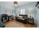 Cozy room with a loveseat, natural light, and a relaxing ambiance at 1106 Ayrshire St, Orlando, FL 32803