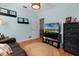 Comfortable sitting room with a loveseat and a view of the backyard at 1106 Ayrshire St, Orlando, FL 32803