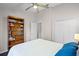 Bedroom featuring a bookshelf, a ceiling fan, hardwood floors, and a closet at 1124 Shadowbrook Trl, Winter Springs, FL 32708