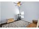 Cozy bedroom featuring a ceiling fan, wood floors, and a neutral color palette at 1124 Shadowbrook Trl, Winter Springs, FL 32708