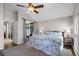 Bedroom featuring a bed, a ceiling fan, a sliding door, and an area rug on hardwood floors at 1124 Shadowbrook Trl, Winter Springs, FL 32708