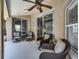 Outdoor seating area with neutral furniture, ceiling fan, and access to the main house at 1124 Shadowbrook Trl, Winter Springs, FL 32708