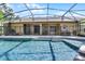 Inviting pool and screened-in lanai, perfect for outdoor relaxation and entertainment at 1124 Shadowbrook Trl, Winter Springs, FL 32708
