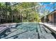 Sparkling screened pool surrounded by lush landscaping and a spacious deck at 1124 Shadowbrook Trl, Winter Springs, FL 32708