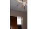 Modest bedroom featuring a ceiling fan and a window with natural light at 11625 Churchill St, Orlando, FL 32817