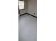 This is an empty bedroom with freshly painted white floors at 11625 Churchill St, Orlando, FL 32817