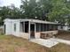 Front view of the home, showing address and covered entry at 11625 Churchill St, Orlando, FL 32817