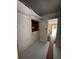 Hallway has fresh paint on the floor and walls with access to other rooms of the house at 11625 Churchill St, Orlando, FL 32817
