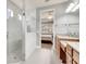 Bright bathroom with a glass walk-in shower and granite vanity at 11885 Padua Ln, Orlando, FL 32827