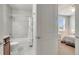 Bathroom featuring shower-over-tub and access to bedroom at 11885 Padua Ln, Orlando, FL 32827