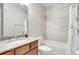 Bathroom with granite vanity, framed mirror and shower-over-tub at 11885 Padua Ln, Orlando, FL 32827