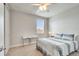 Bedroom with ceiling fan, natural light, and a desk area at 11885 Padua Ln, Orlando, FL 32827